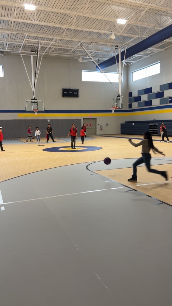 Student in Kickball after school enrichment program.