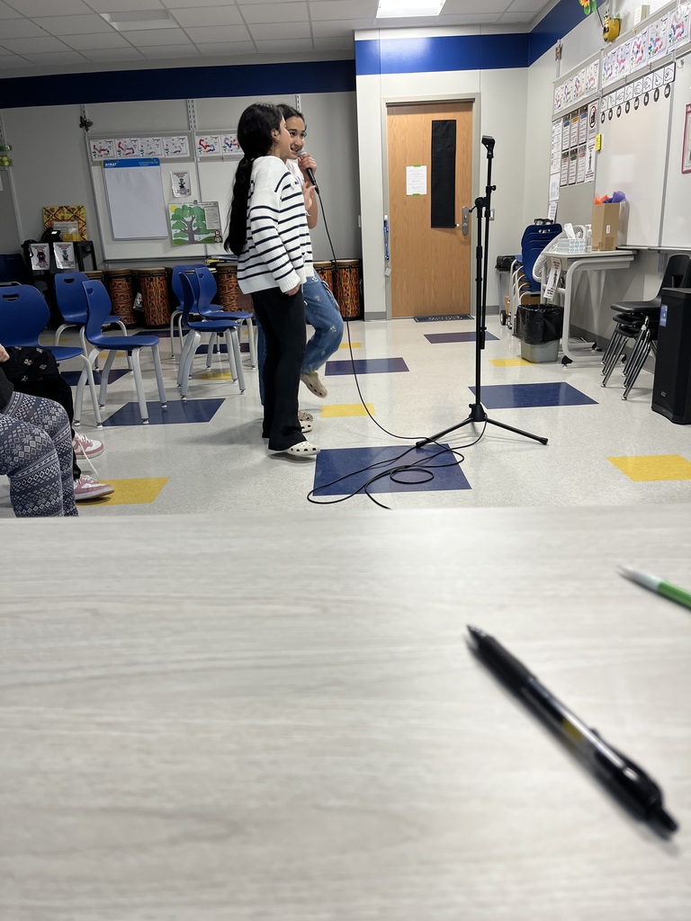 Student in Karaoke after school enrichment program.