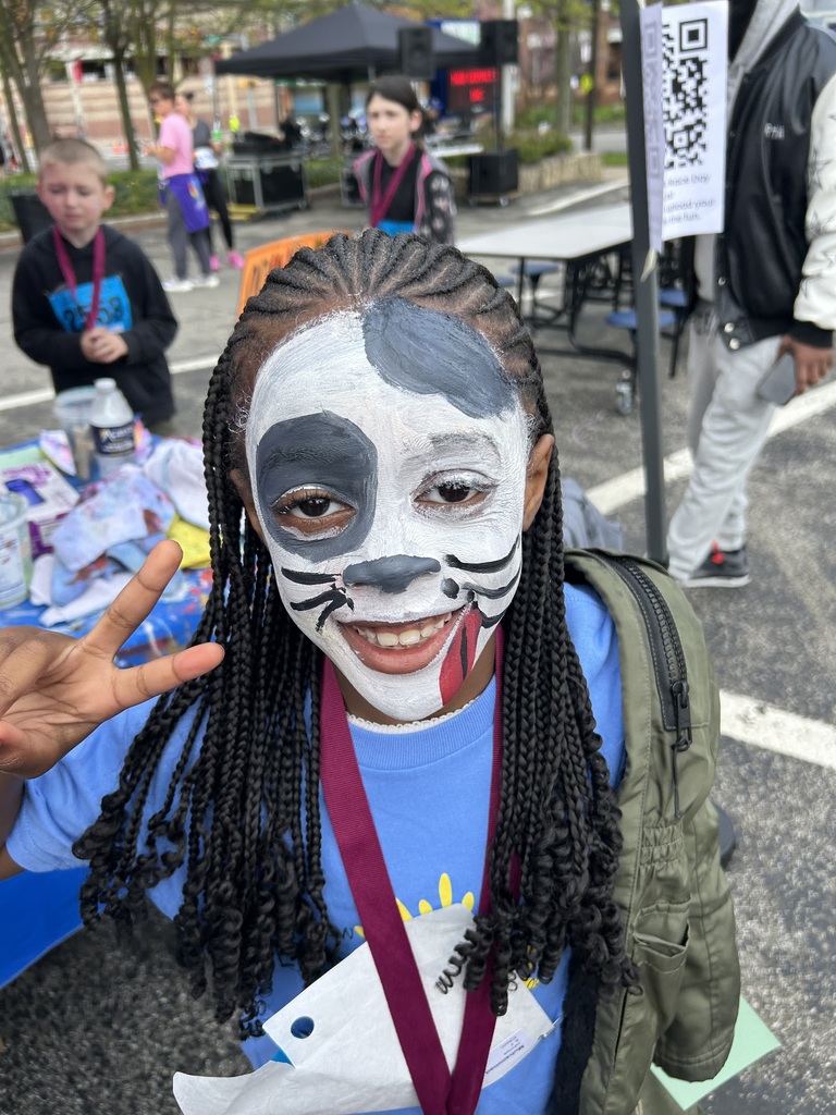 Student with face paint at the Art & Sole 5K.