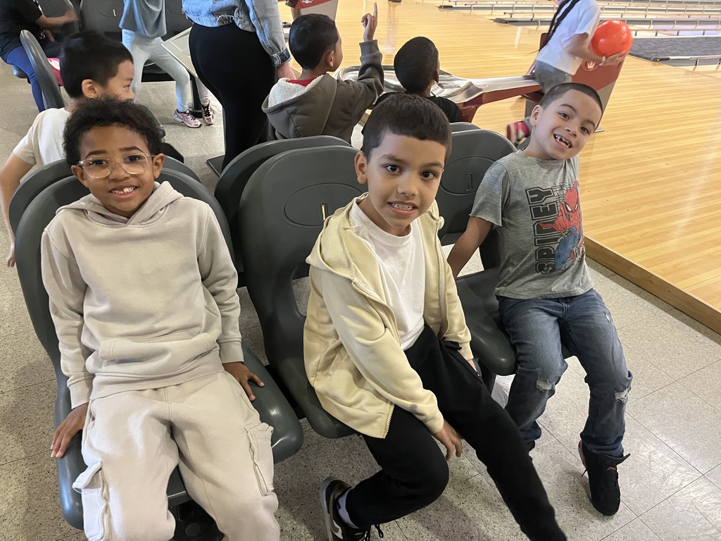 students sitting while bowling