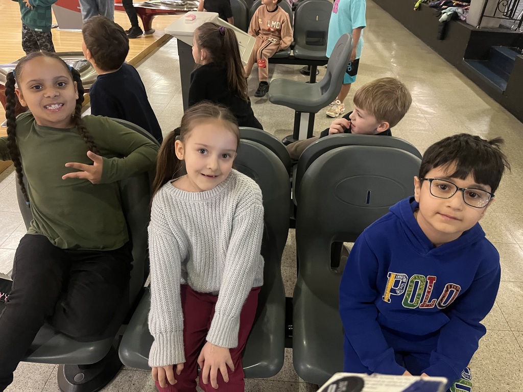 student sitting while bowling