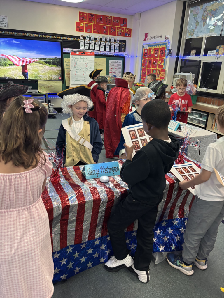 1st grade students dressed up as historical figures for their "living museum" project.