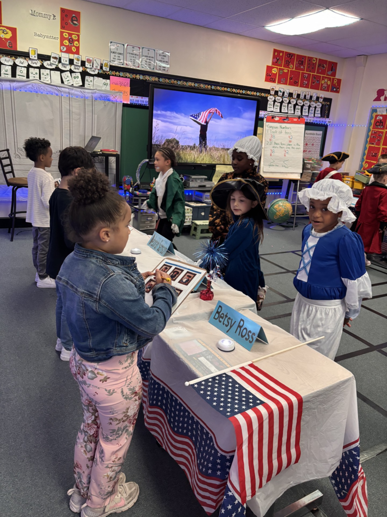 1st grade students dressed up as historical figures for their "living museum" project.