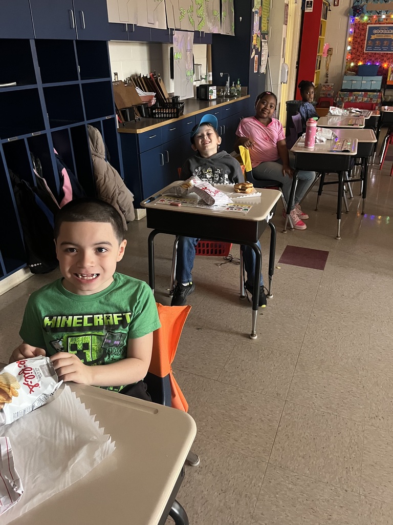 students at their desk, eating Chick-fil-A