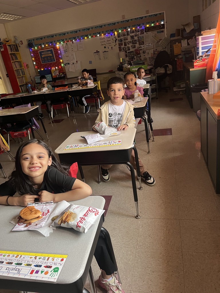 students at their desk, eating Chick-fil-A