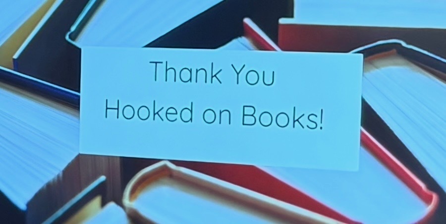 Sign saying "Thank You Hooked on Books!"