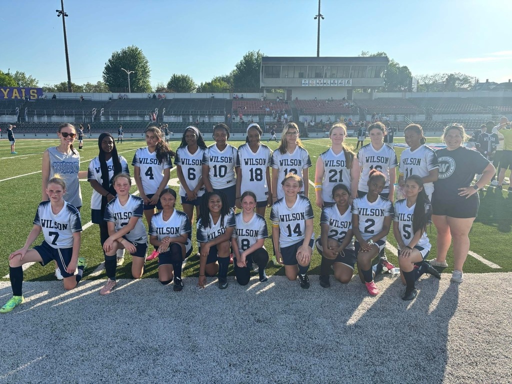 Girls soccer team on field.