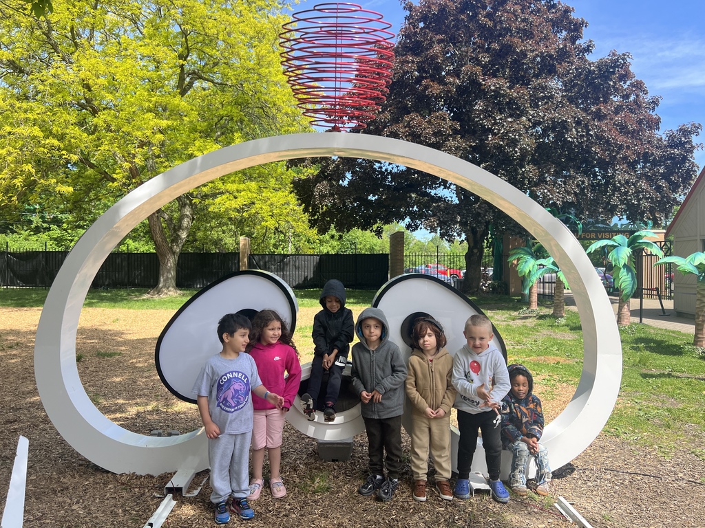 students at the zoo taking a picture