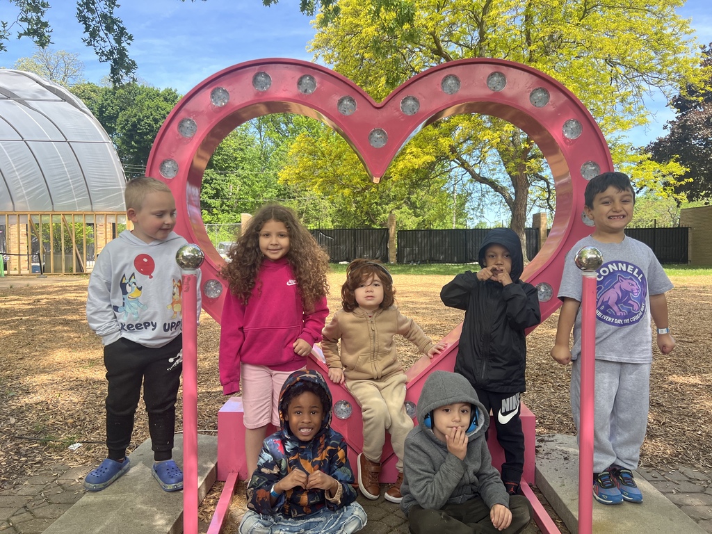 students at the zoo taking a picture