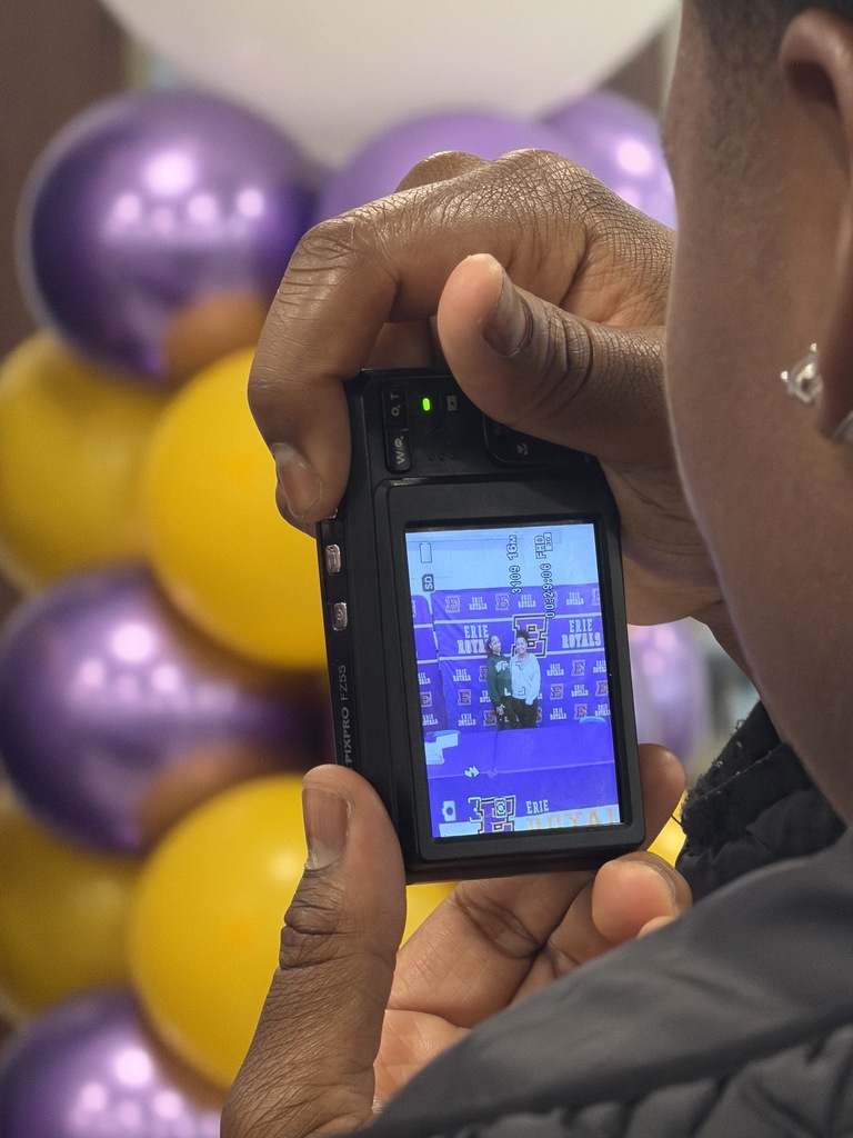 Someone taking a photo on a camera.