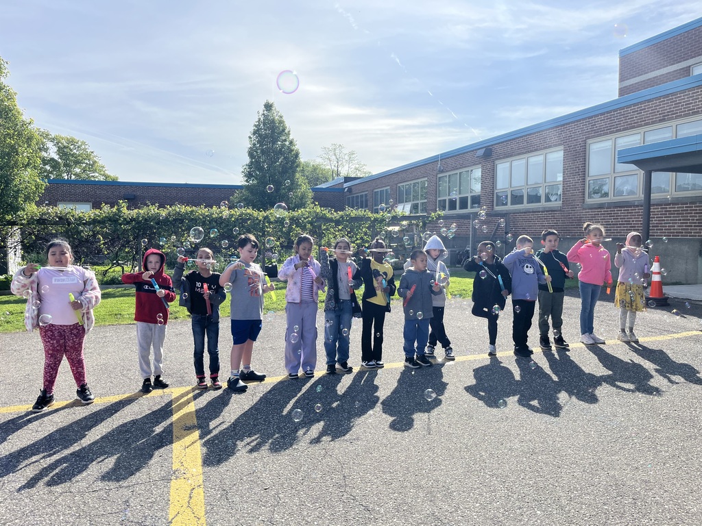 students blowing bubbles