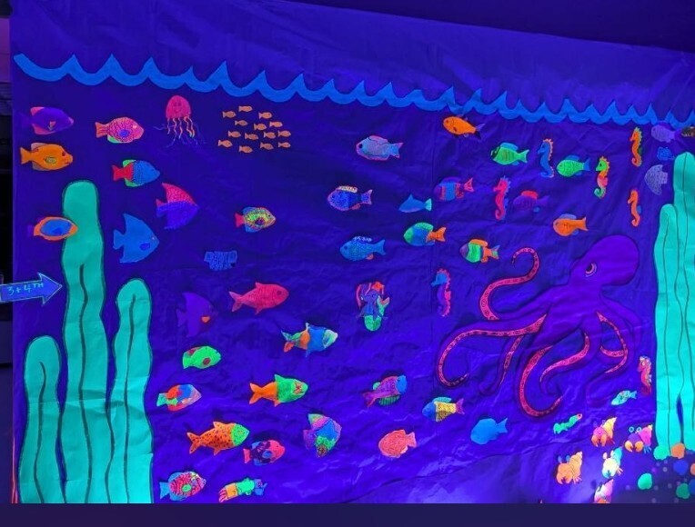 black light art display glowing fish/reef