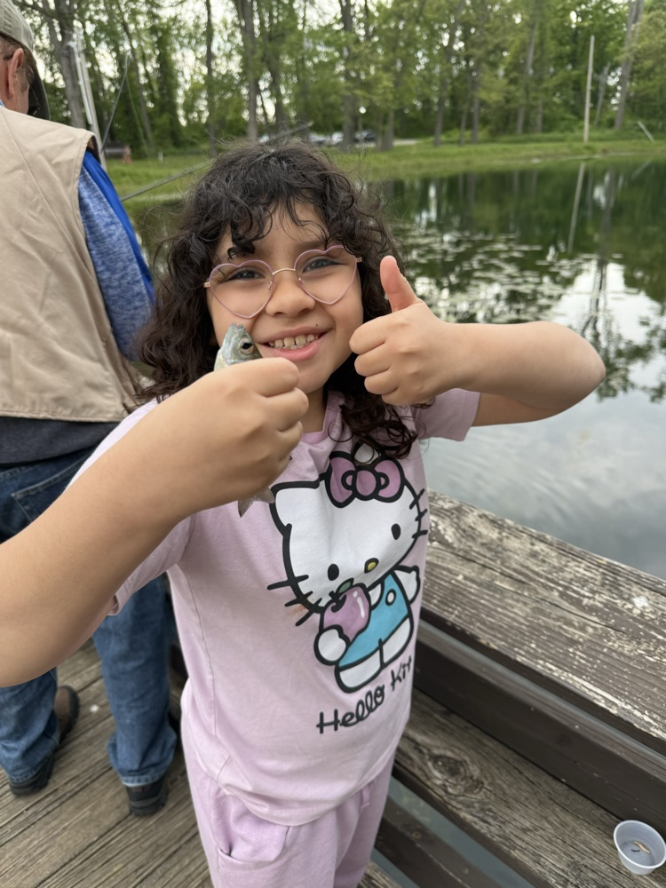 student at family fishing event at the waterworks pond 