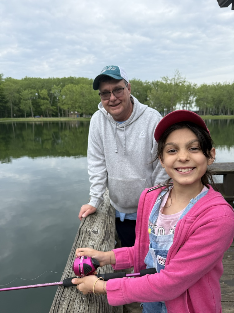 student at family fishing event at the waterworks pond 