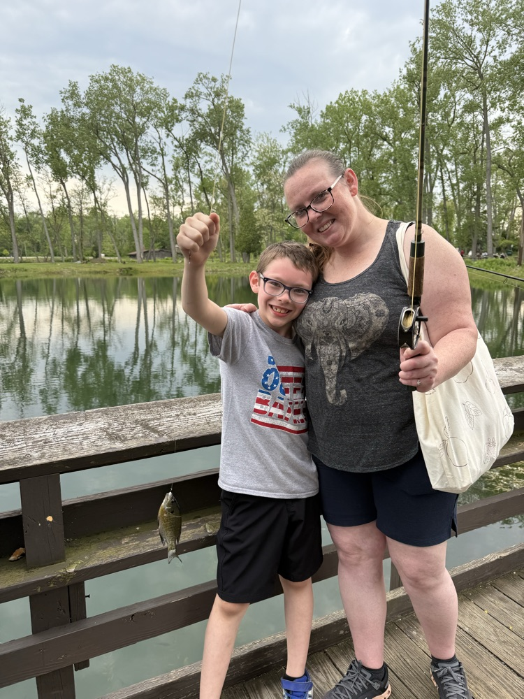 student at family fishing event at the waterworks pond 