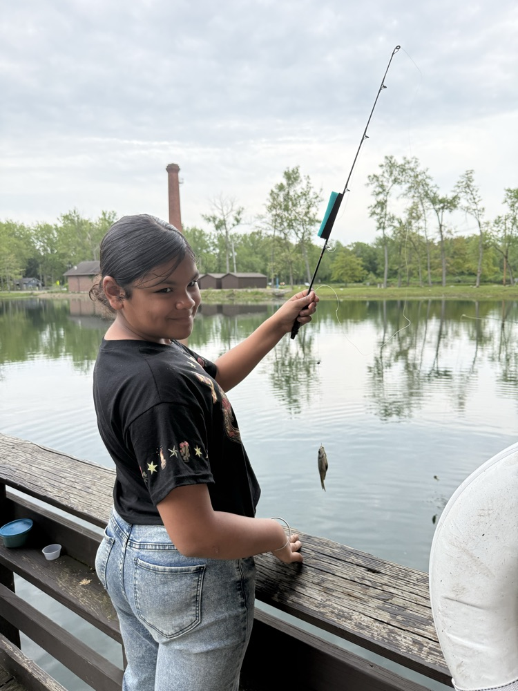student at family fishing event at the waterworks pond 