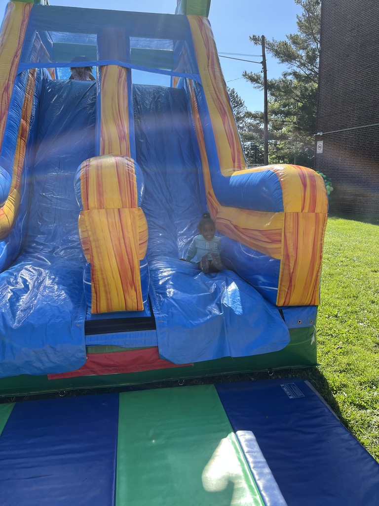Student going down the inflatable slide.