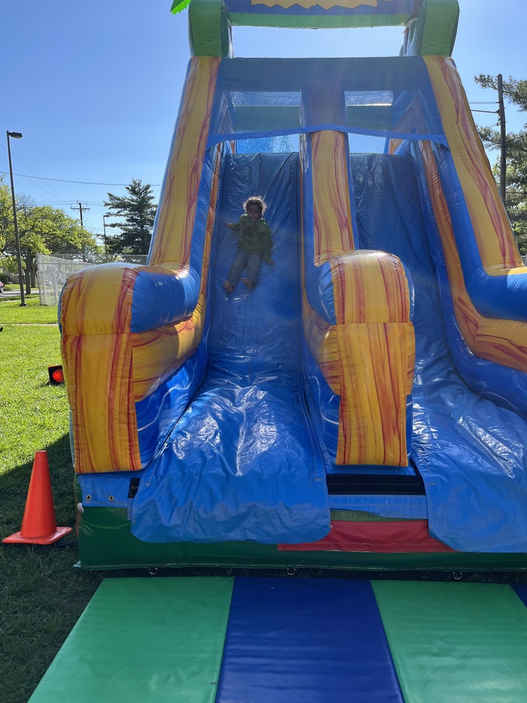 Student going down the inflatable slide.