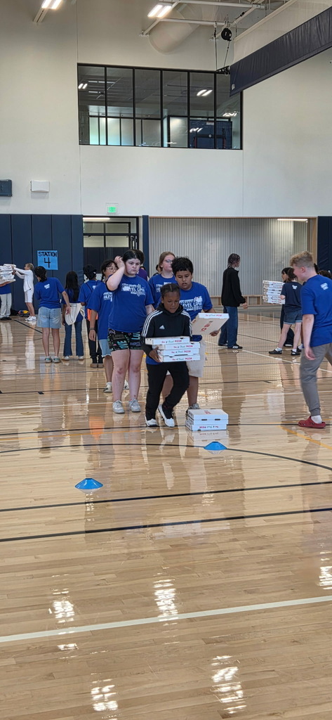 Ambassadors participating in a pizza box relay.