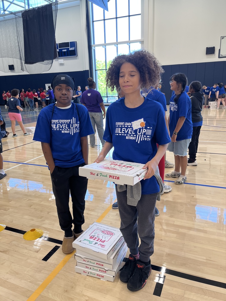 Students participating in the pizza box relay.