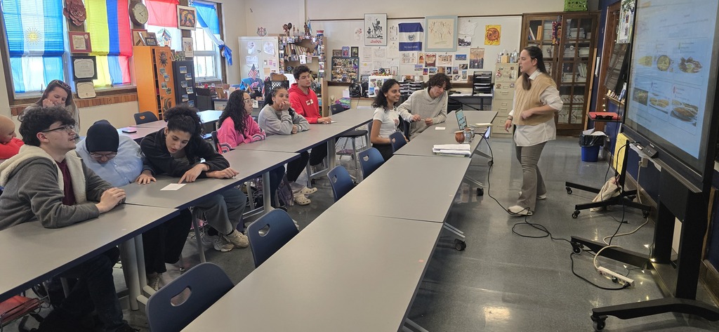 This photo shows students in our World Culture Club listening to a talk by Dr. Zurita-Moreno , a Professor of Spanish at Mercyhurst University