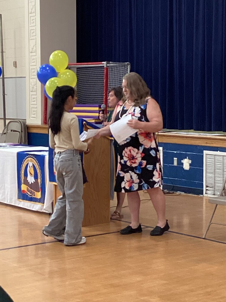 Student receiving a reward