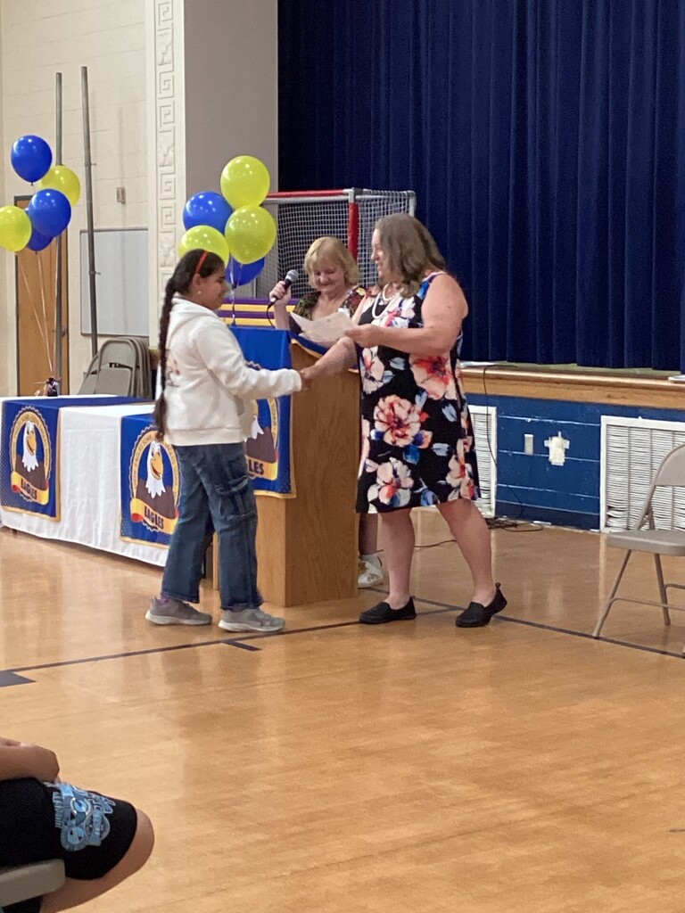 Student receiving a reward
