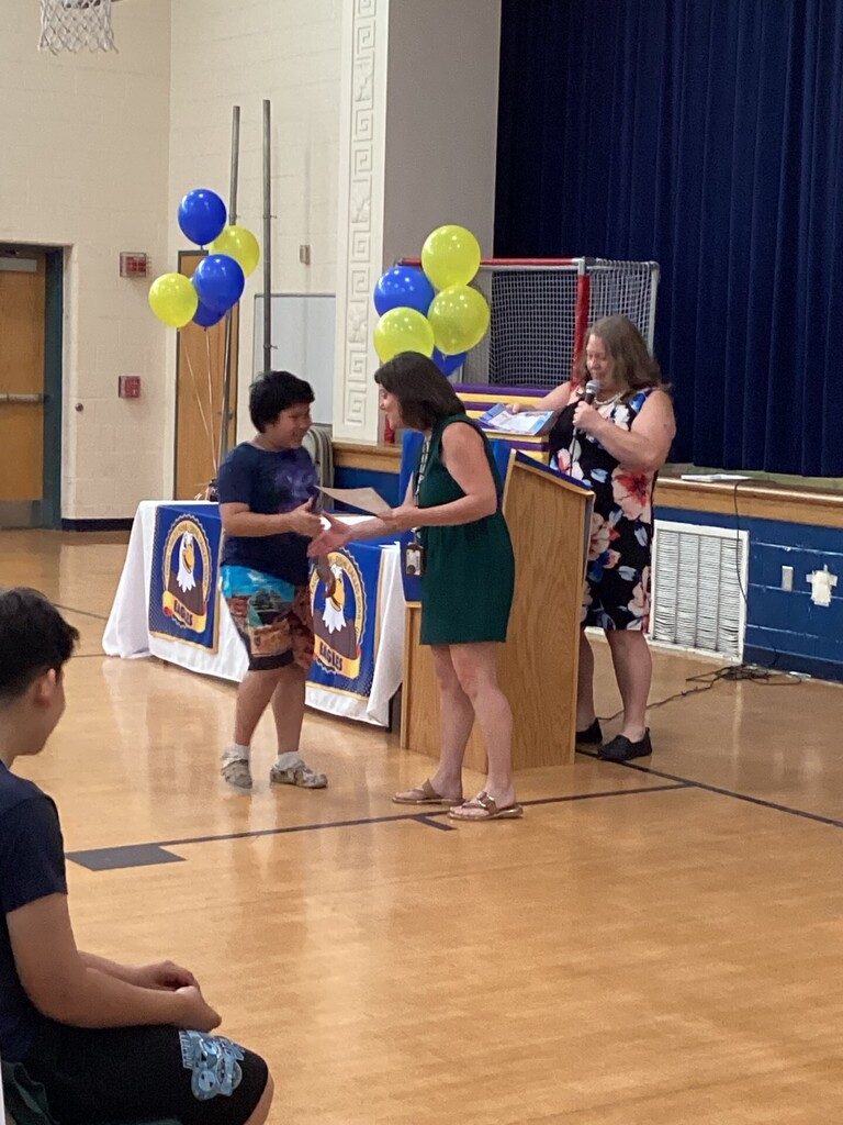 Student receiving a reward