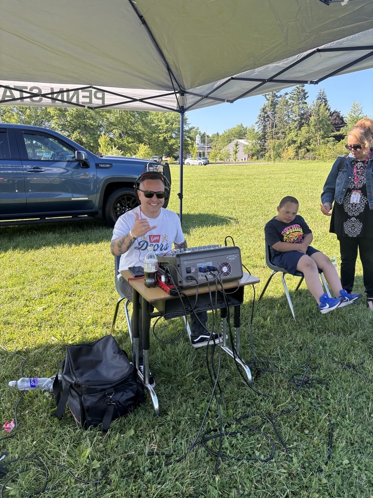 Blue coat playing music for field day