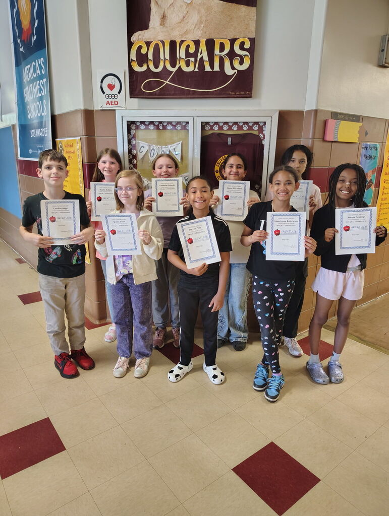 Picture of 9 students with Cool Cougar certificates