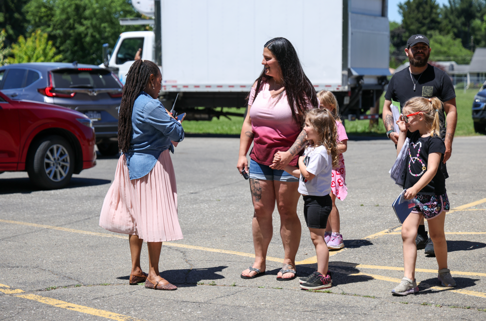 Principal, Deanna McFarland, talking to families and students. 
