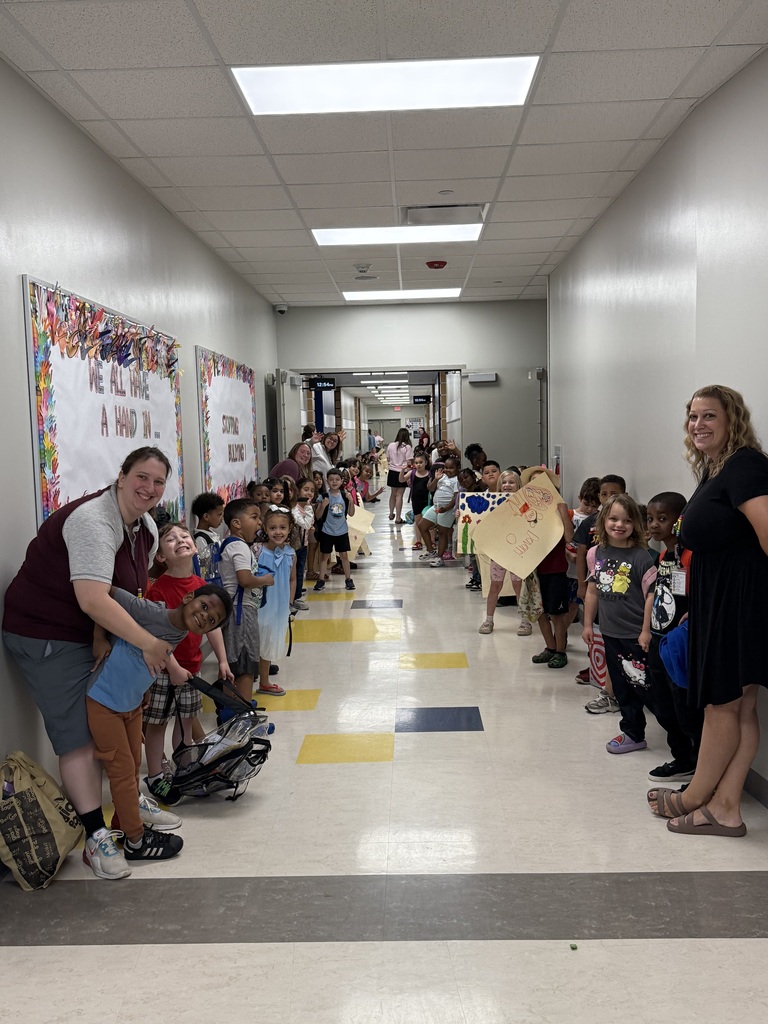 Students and teachers lining the hallway.