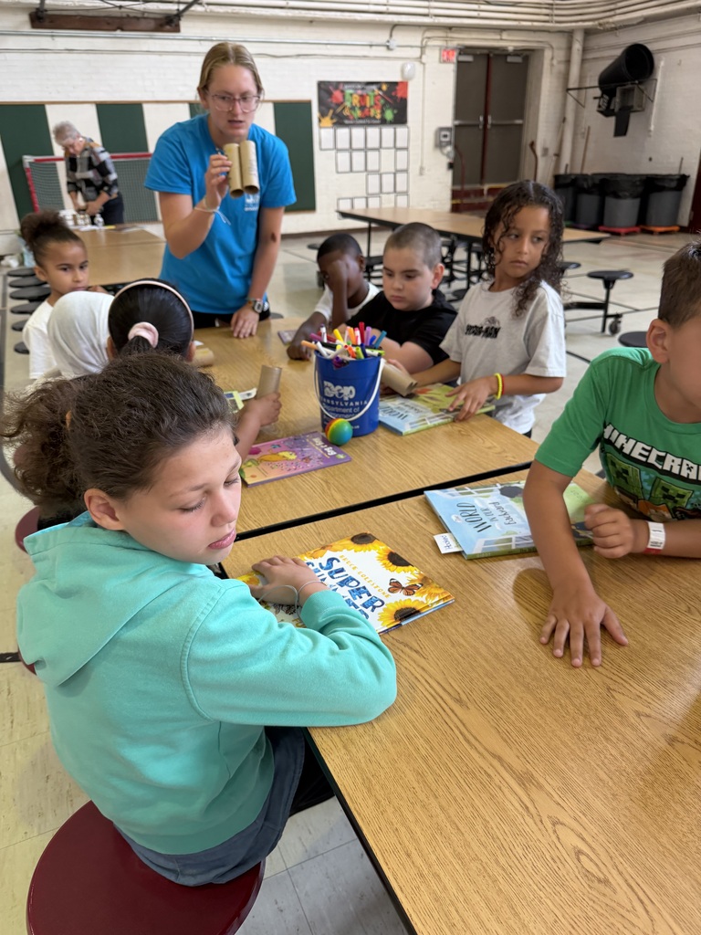 Kids at a table with books