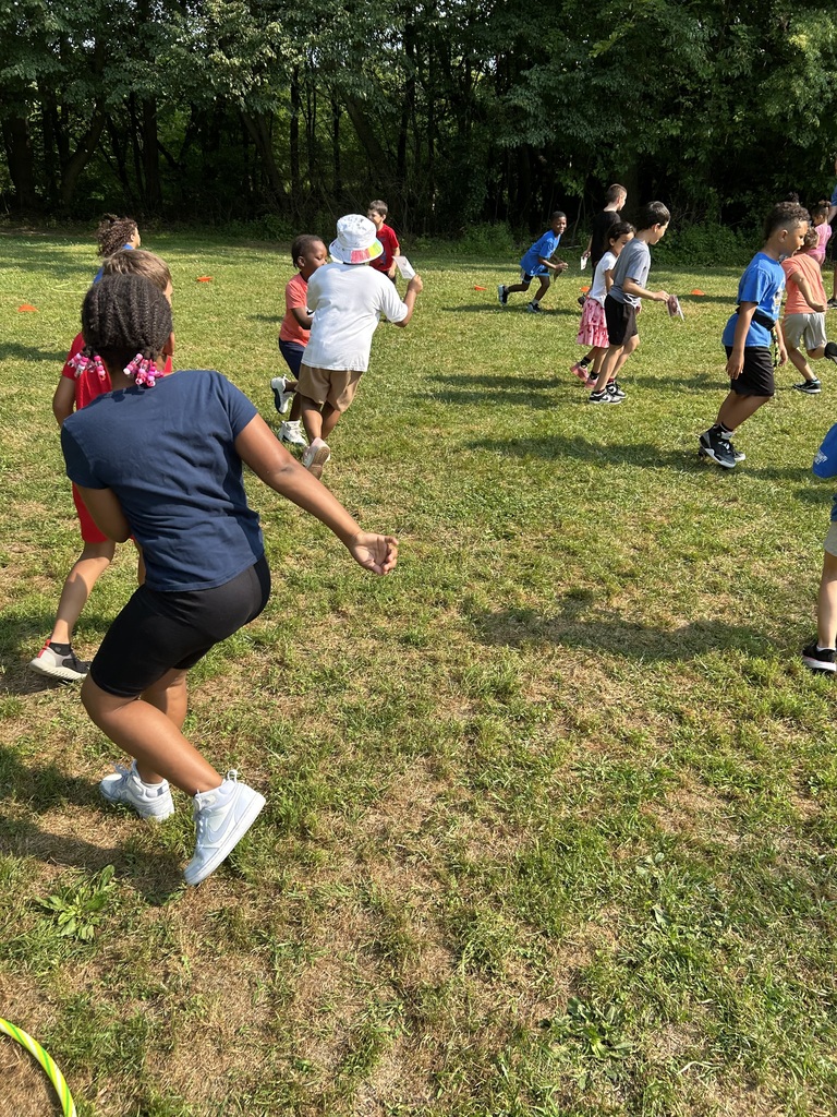 Students running in a field.