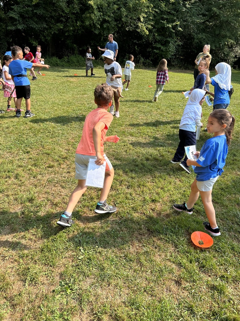 Students running in a field.