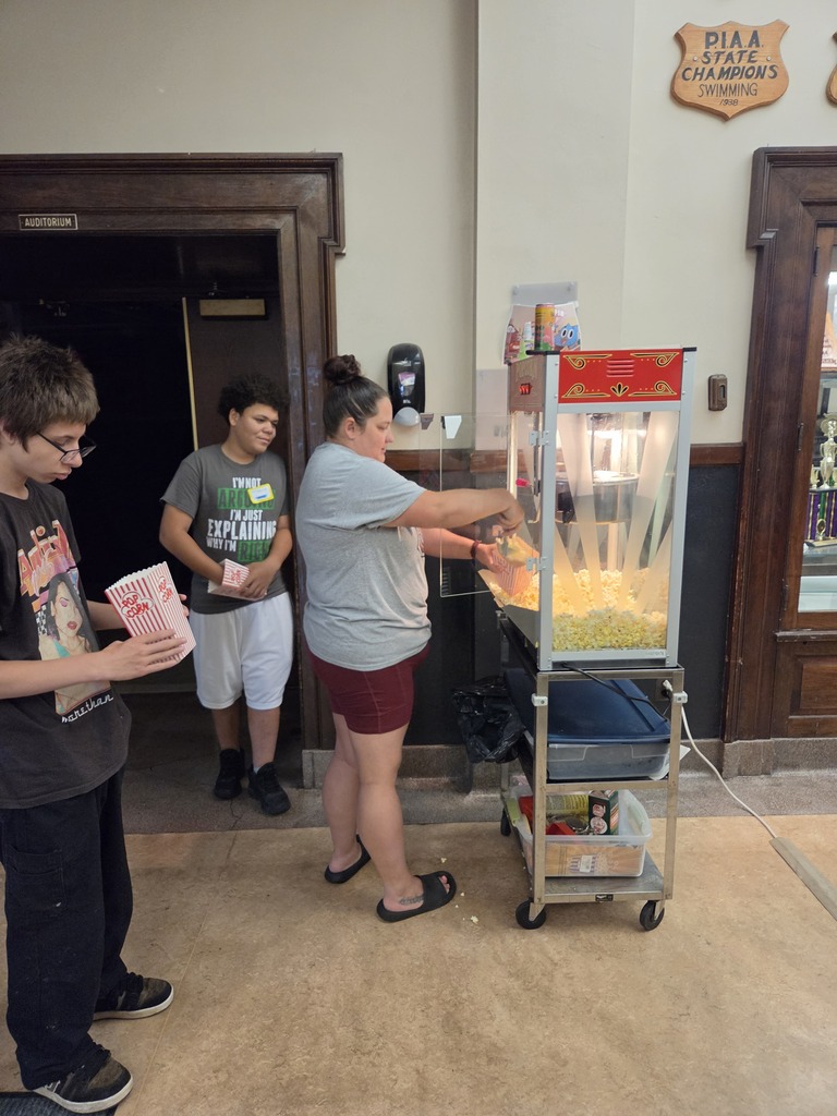 Ms. Katie making popcorn for Boot Camp Movie Day