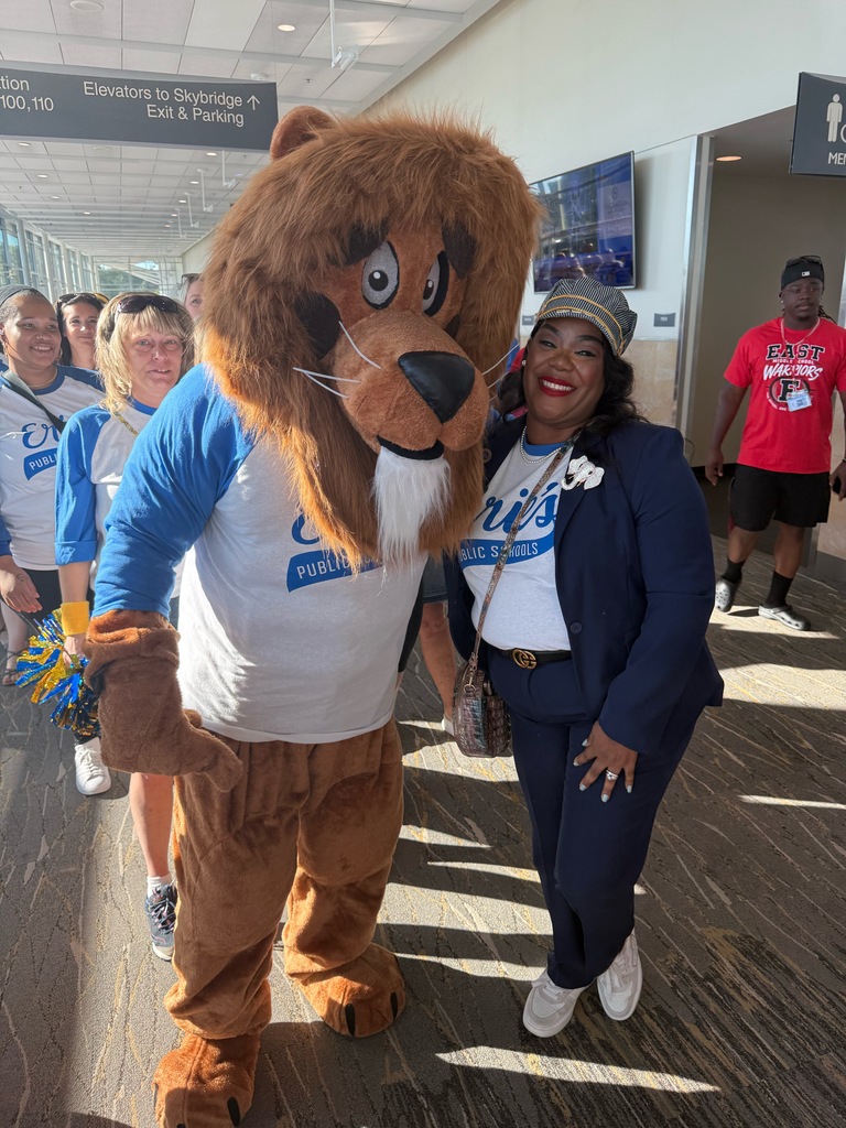 Lincoln Lion mascot posing with Dr. Gibbs.