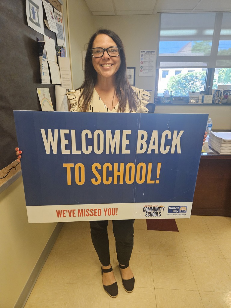 Principal with welcome back sign