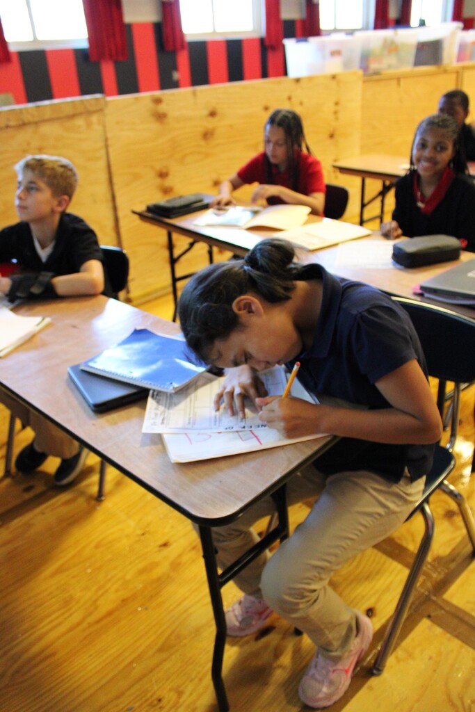 Students working at tables