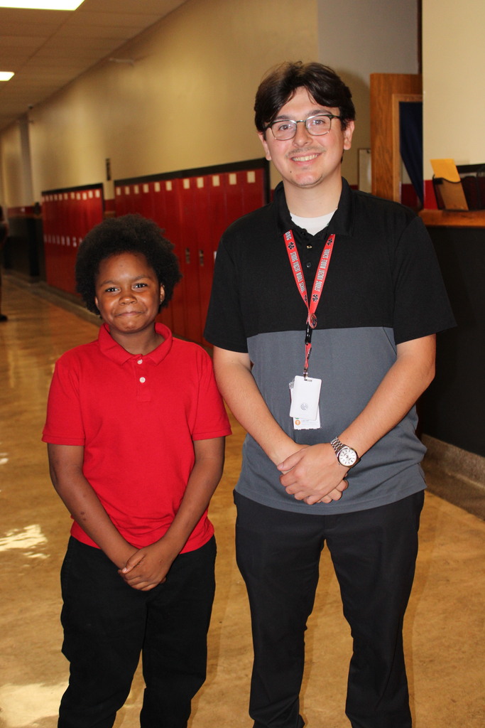 student with an adult staff member