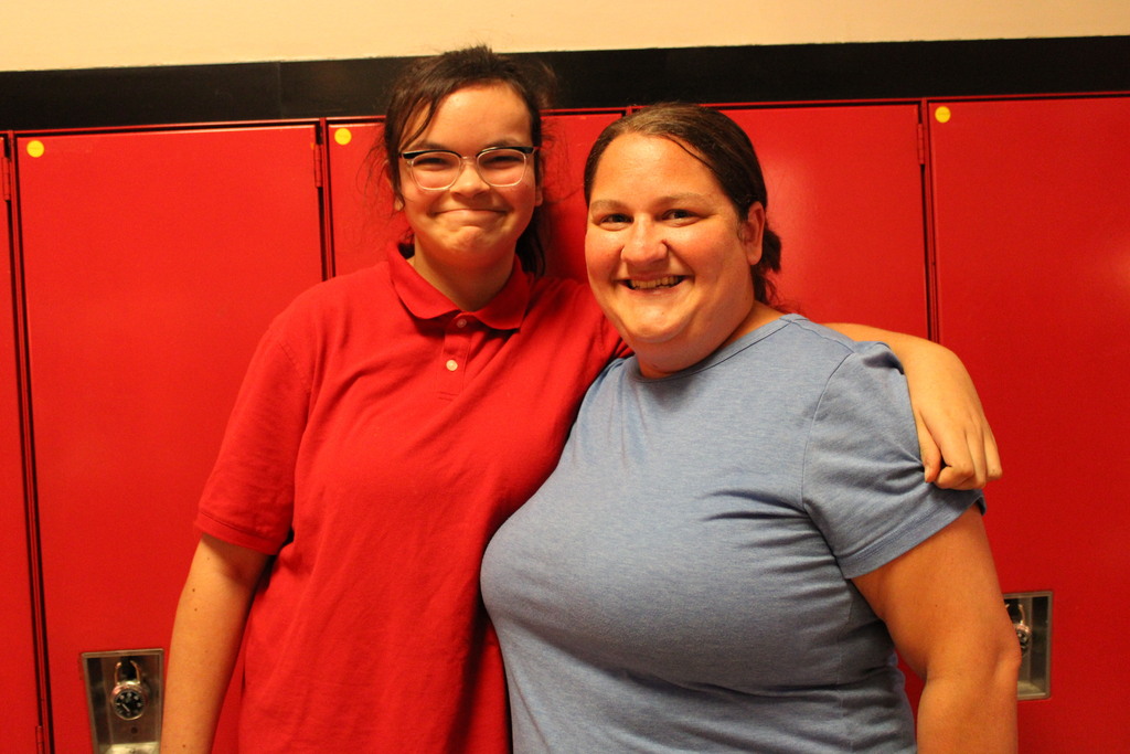 student with an adult staff member