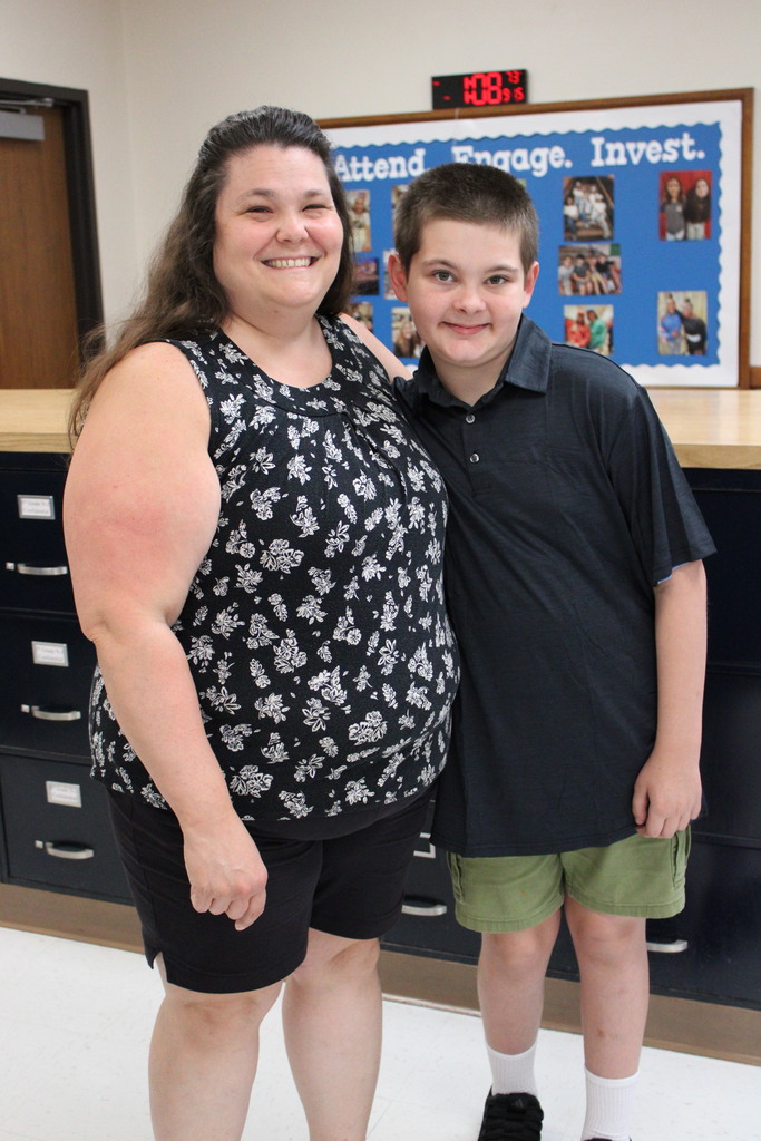 student with an adult staff member