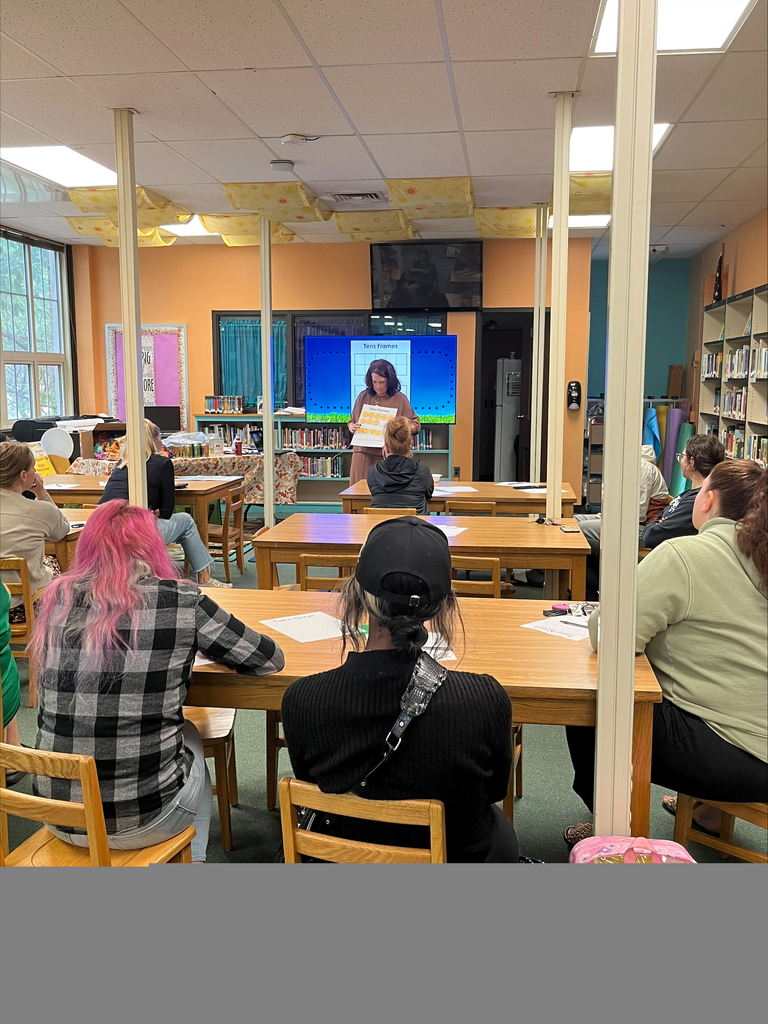 Parents listening to a presentation
