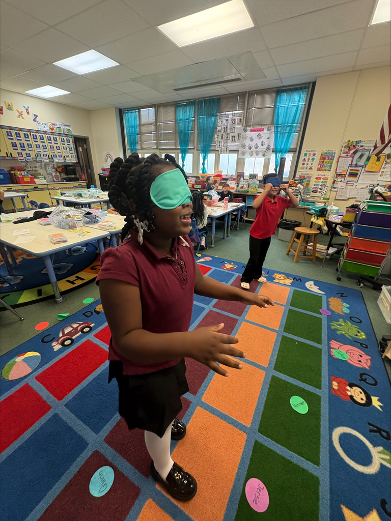 Student walking with an eye mask on