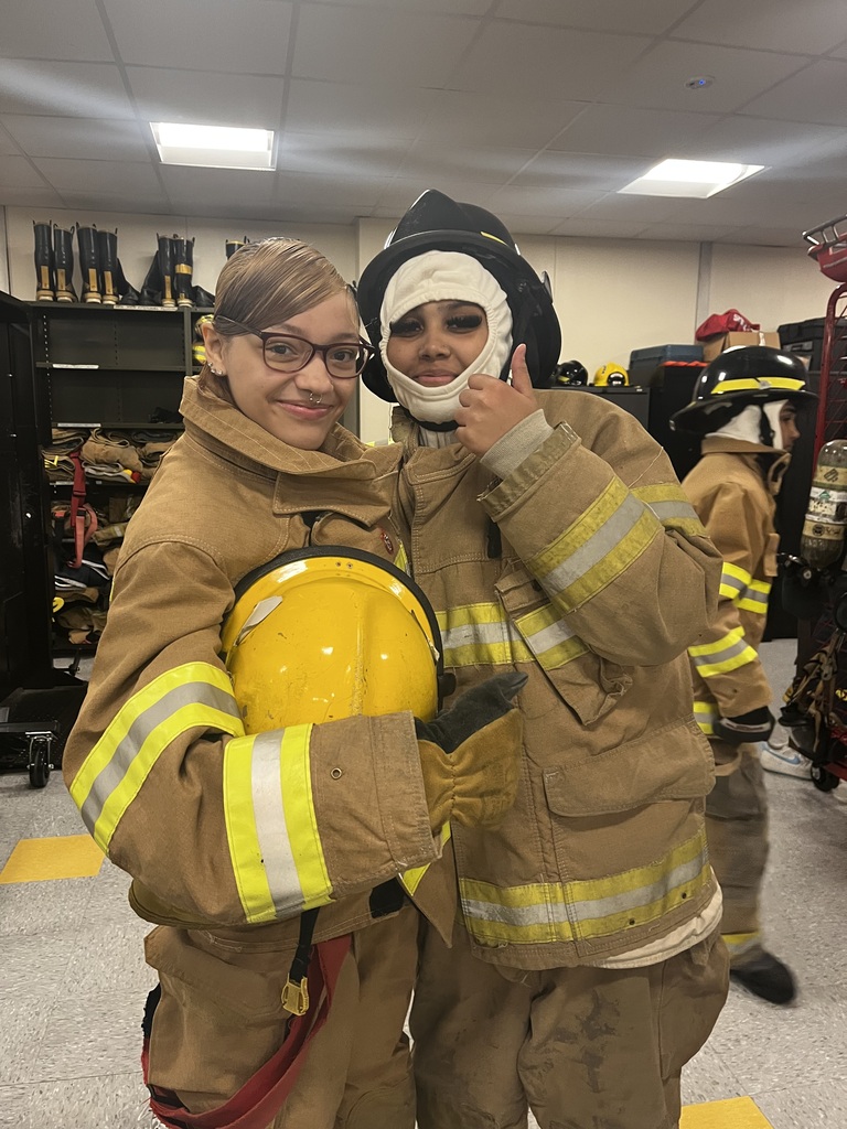 female students in firefighter gear