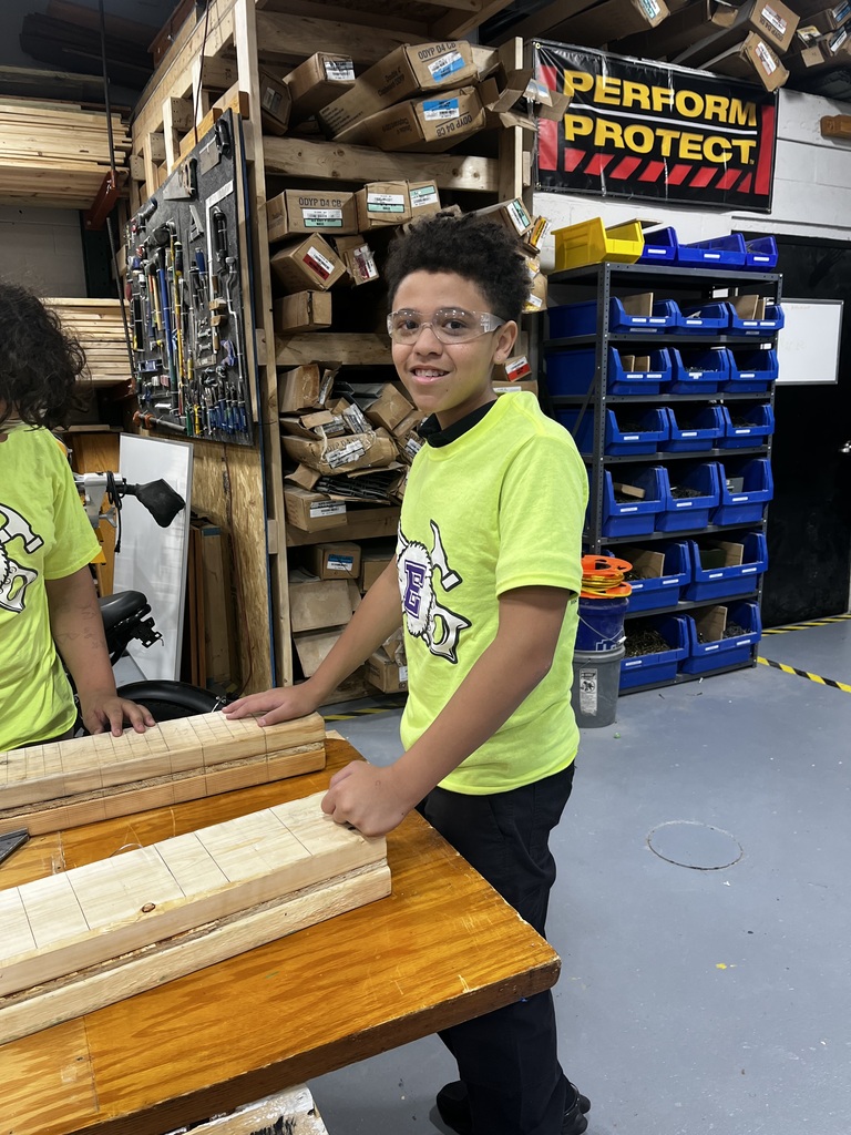 Student wearing safety goggles in a workshop
