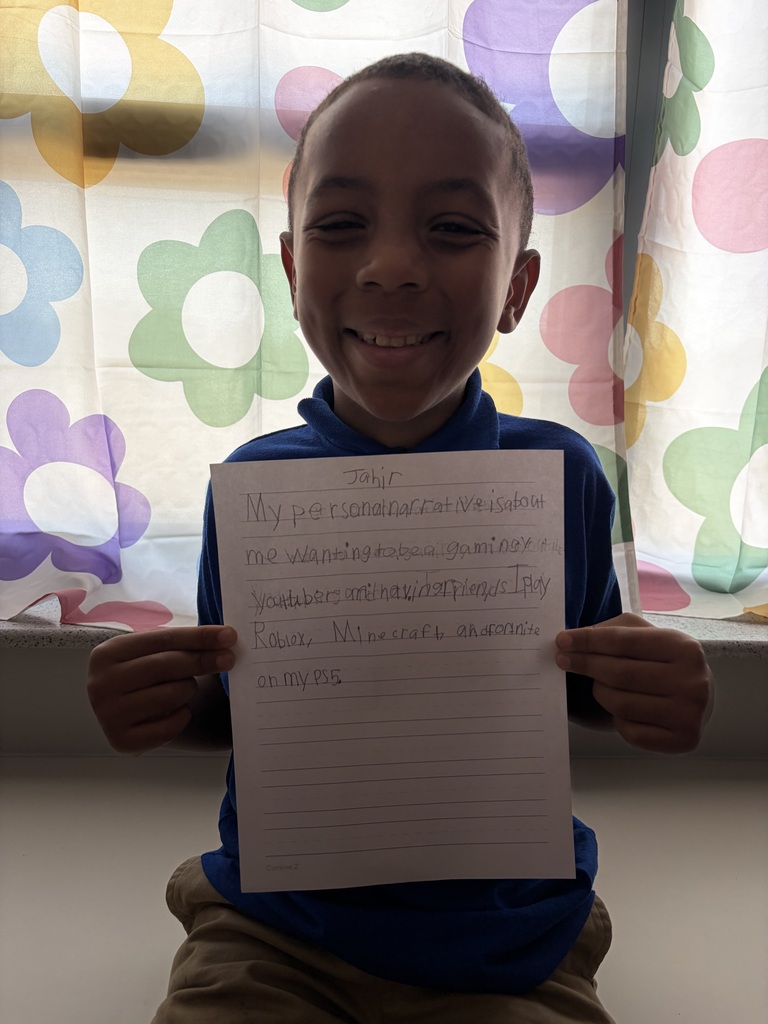 Student holding their paper