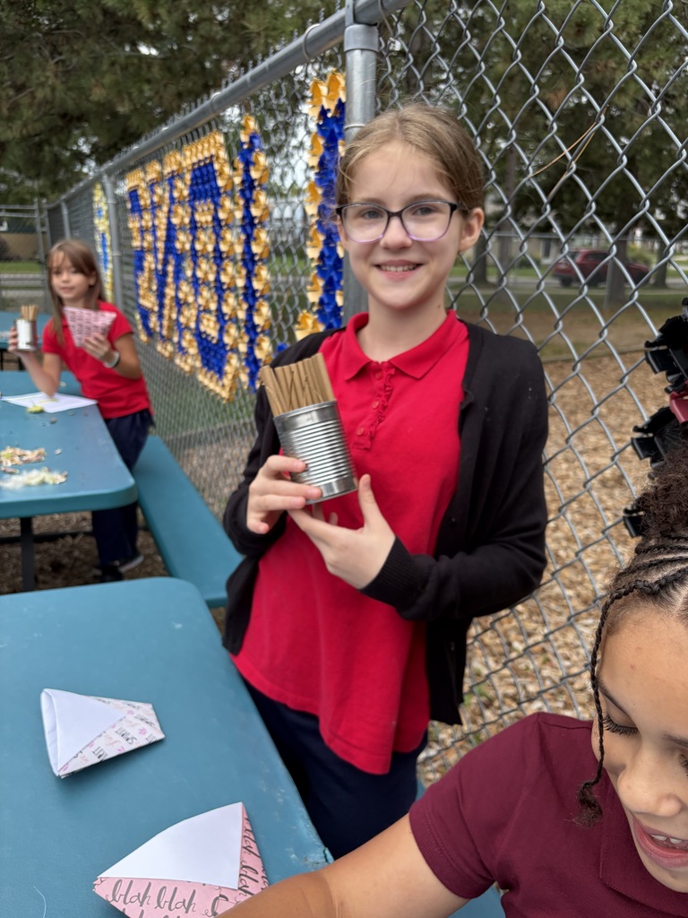 Student holding a solitary bee home.