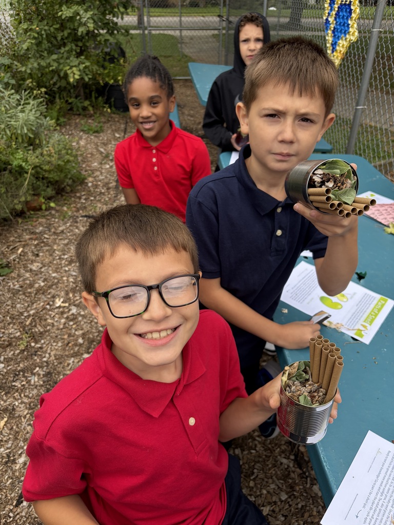 Student holding a solitary bee home.
