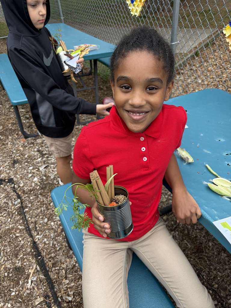 Student holding a solitary bee home.